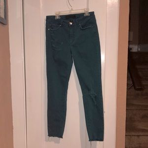 Teal distressed skinny jeans